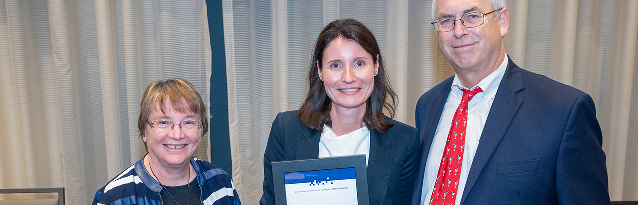 Dean Griffith giving and award to a lady